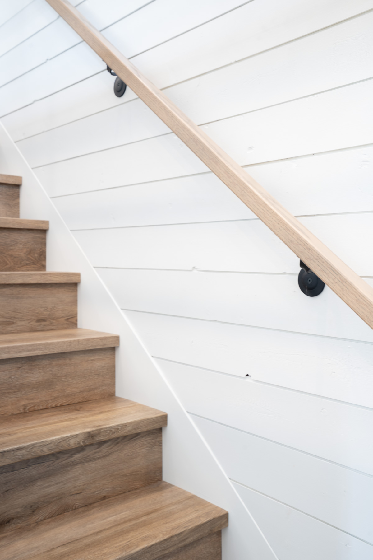 Coquitlam remodel with shiplap and handrails stained to match stairs