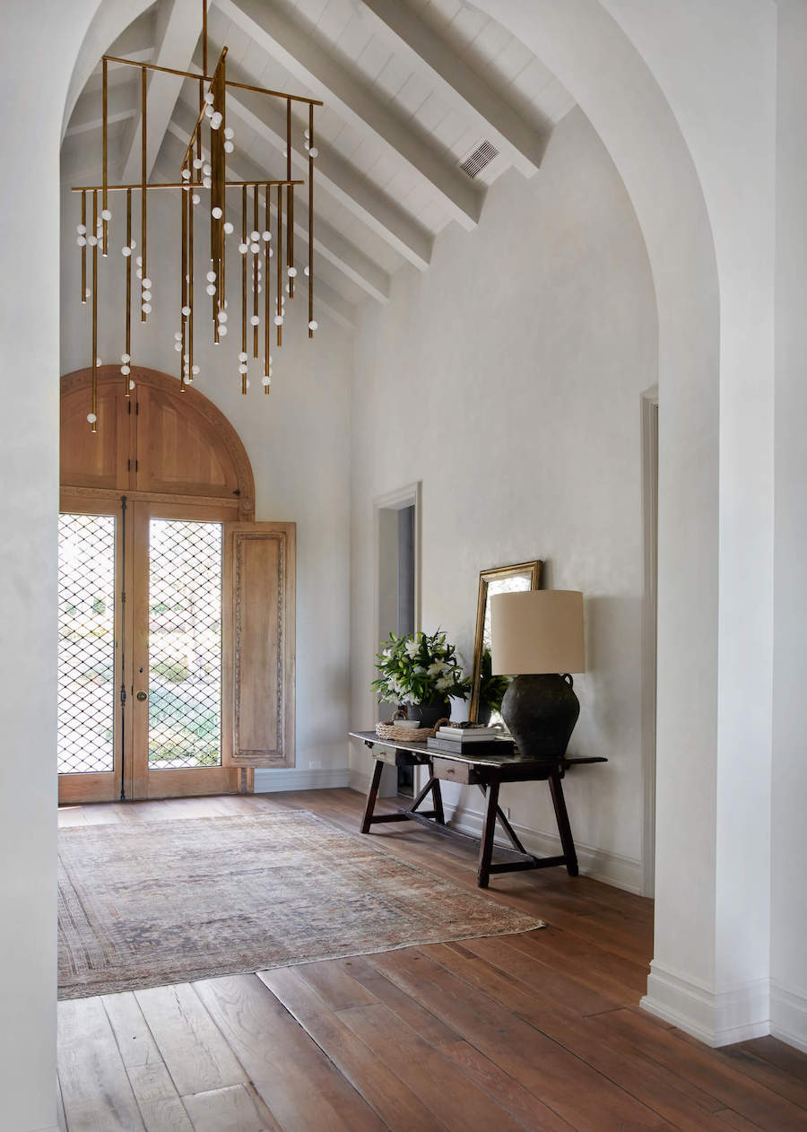 gorgeous entryway with modern chandelier