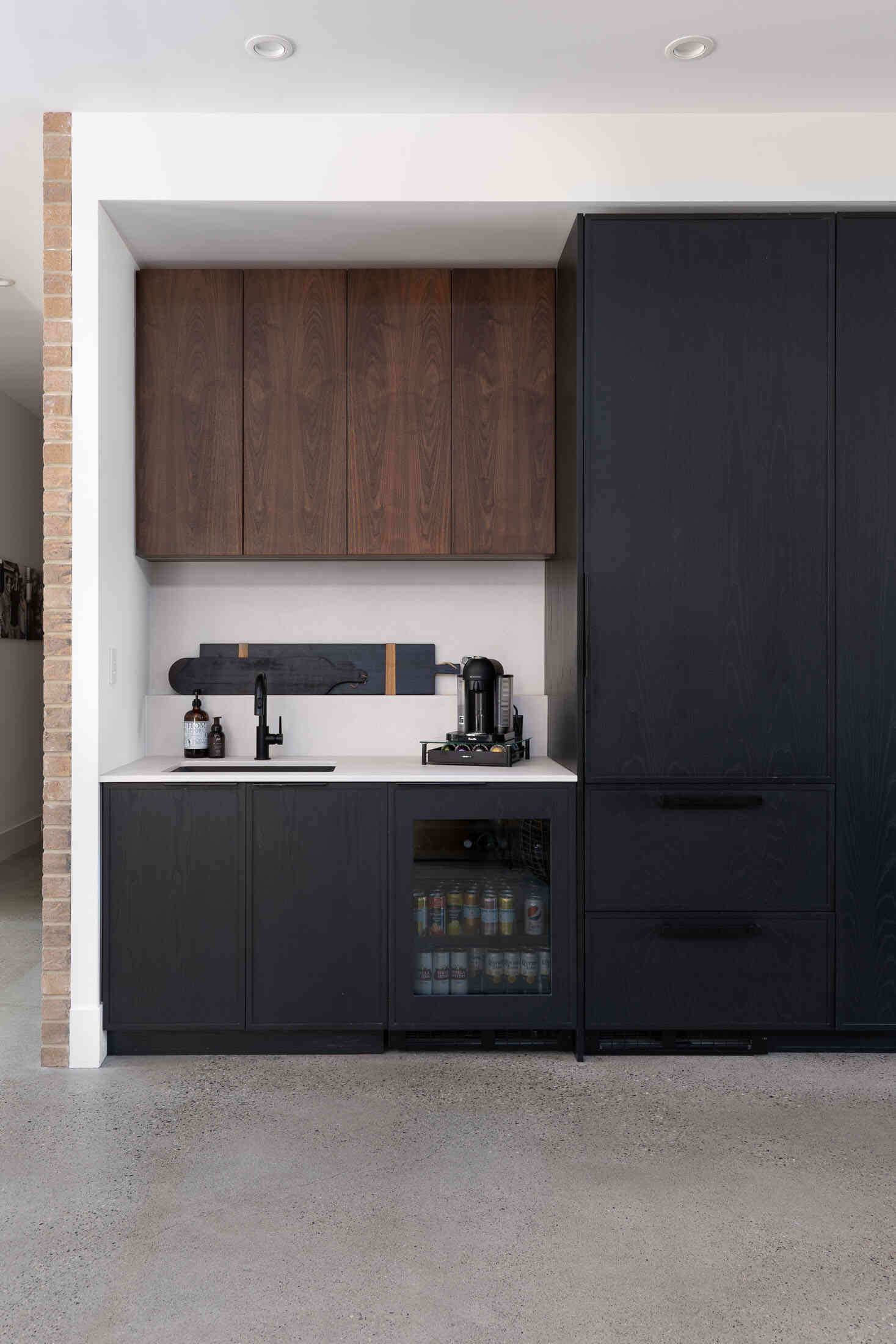 minimalist beverage bar with contrasting wood cabinets