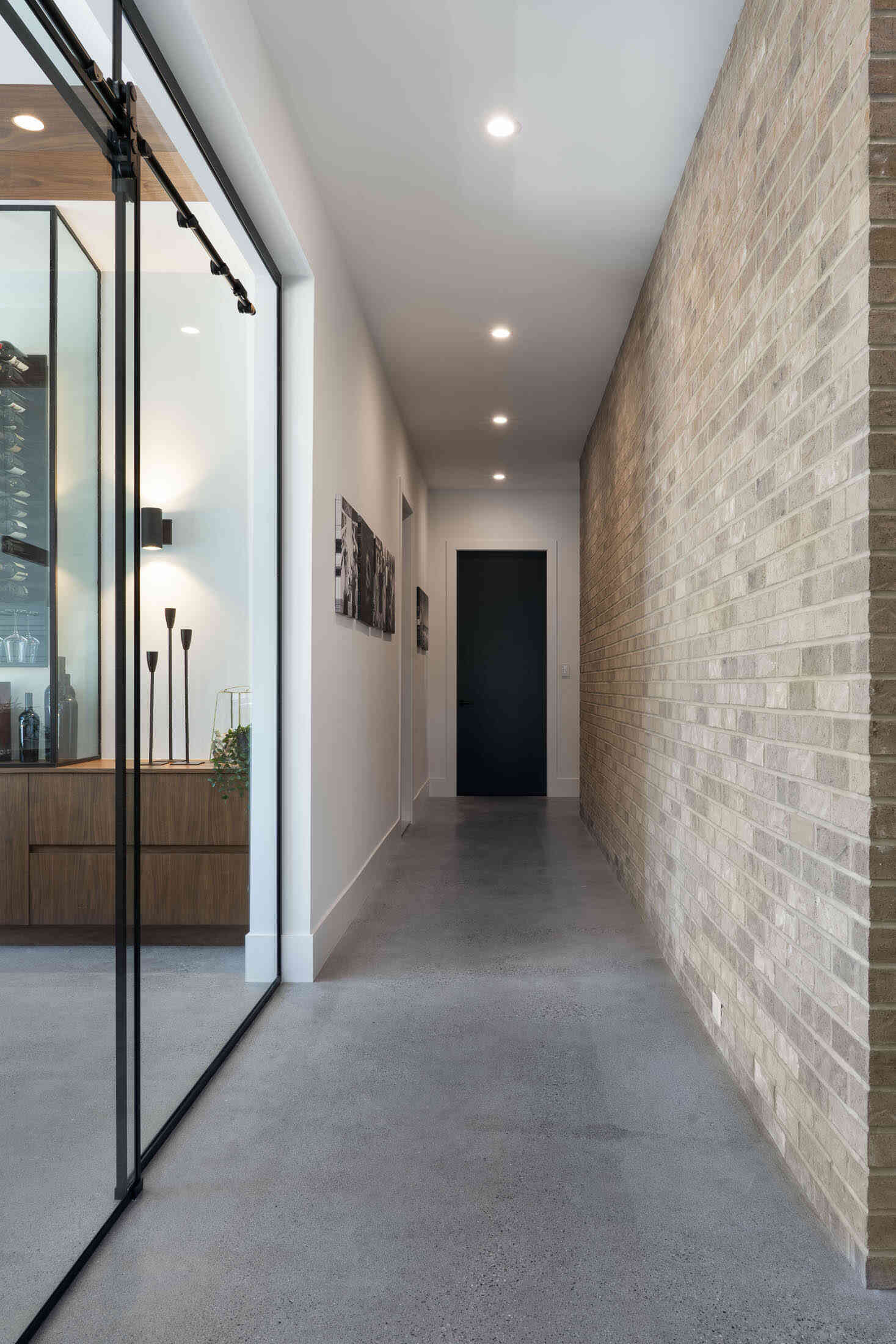 Hallway with faux brick accent wall