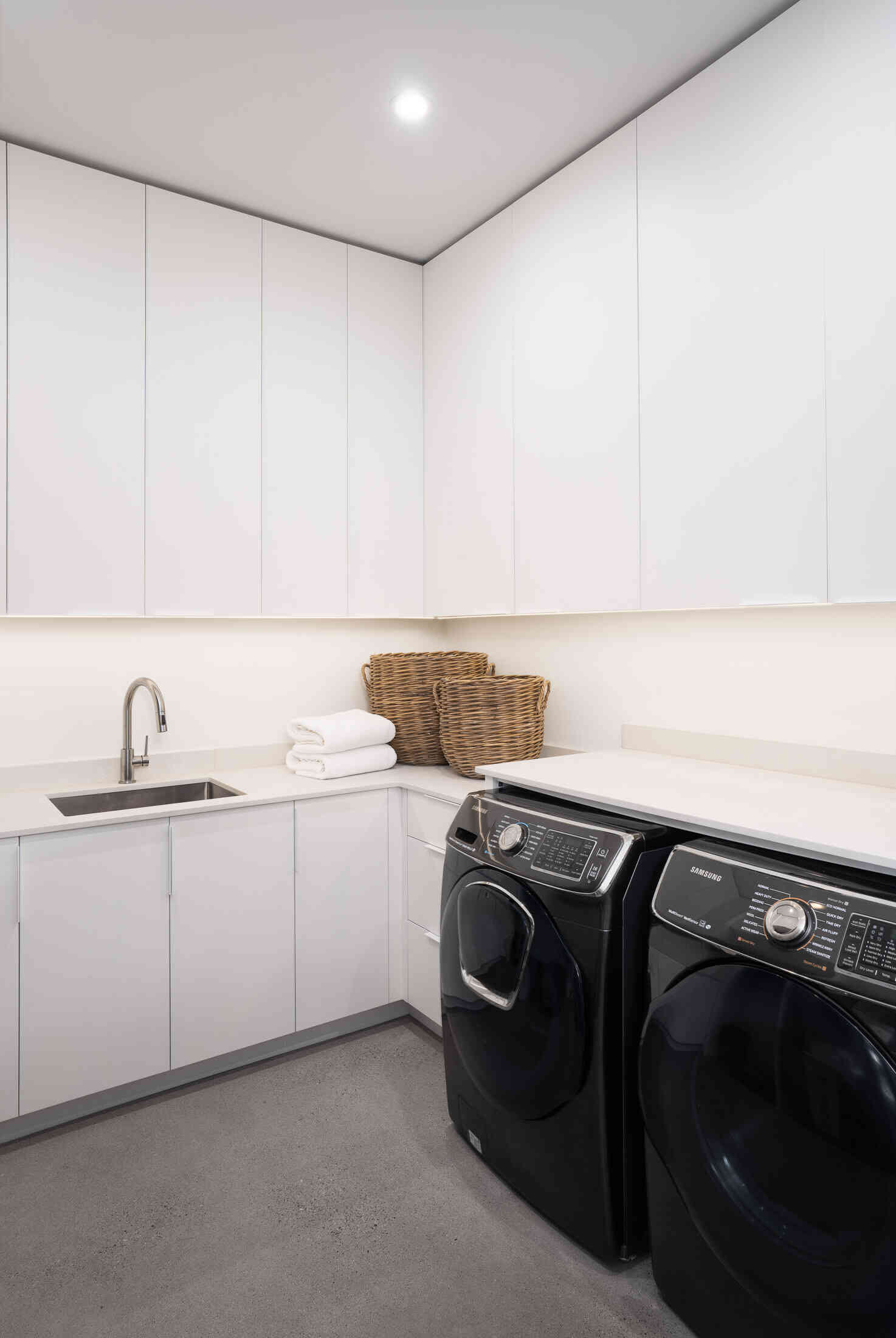 Minimalist white laundry room