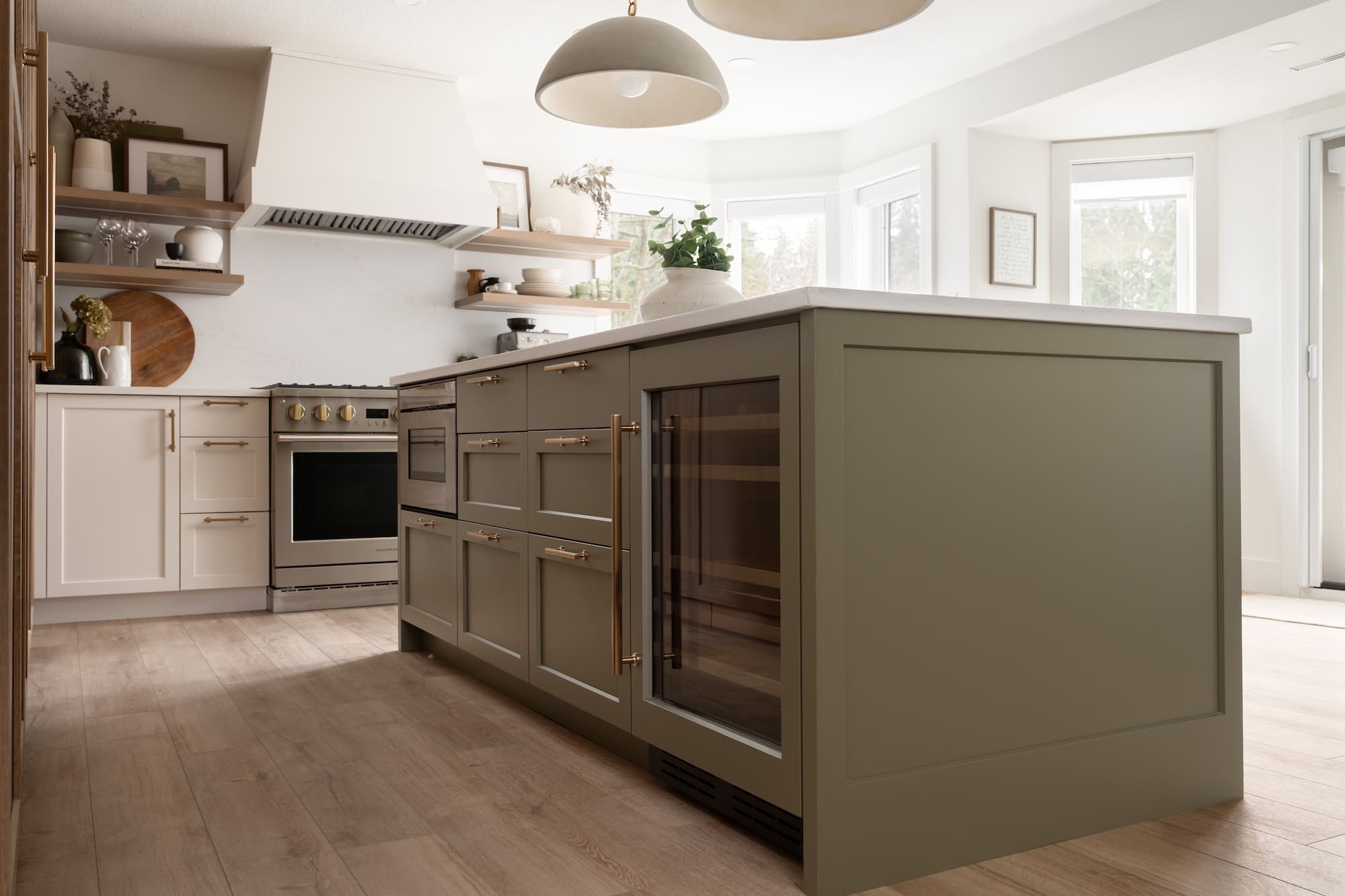 sage green kitchen island in garden suite